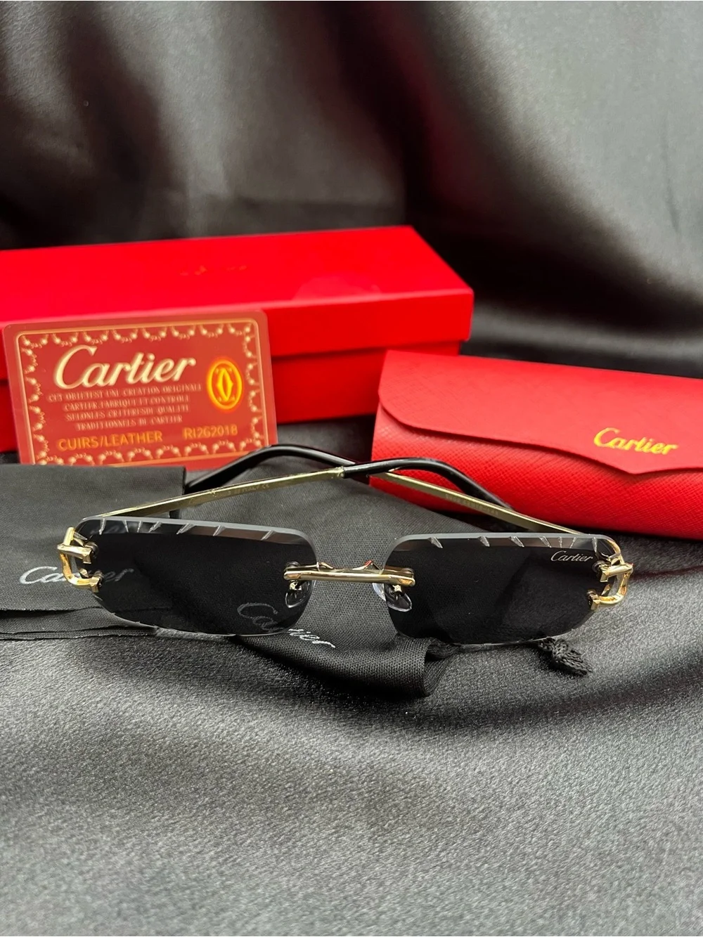 Cartier Men's Black & Gold Rimless Sunglasses with Scalloped Lenses